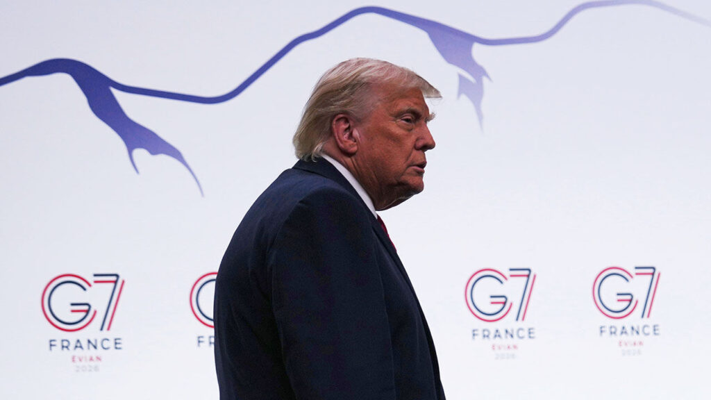US President Donald Trump walks on stage at the G& summit in Evian