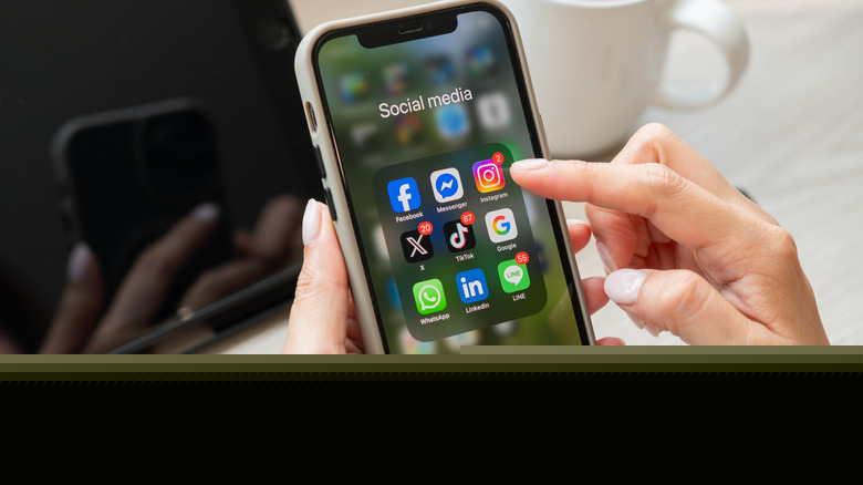 A phone showing social media apps