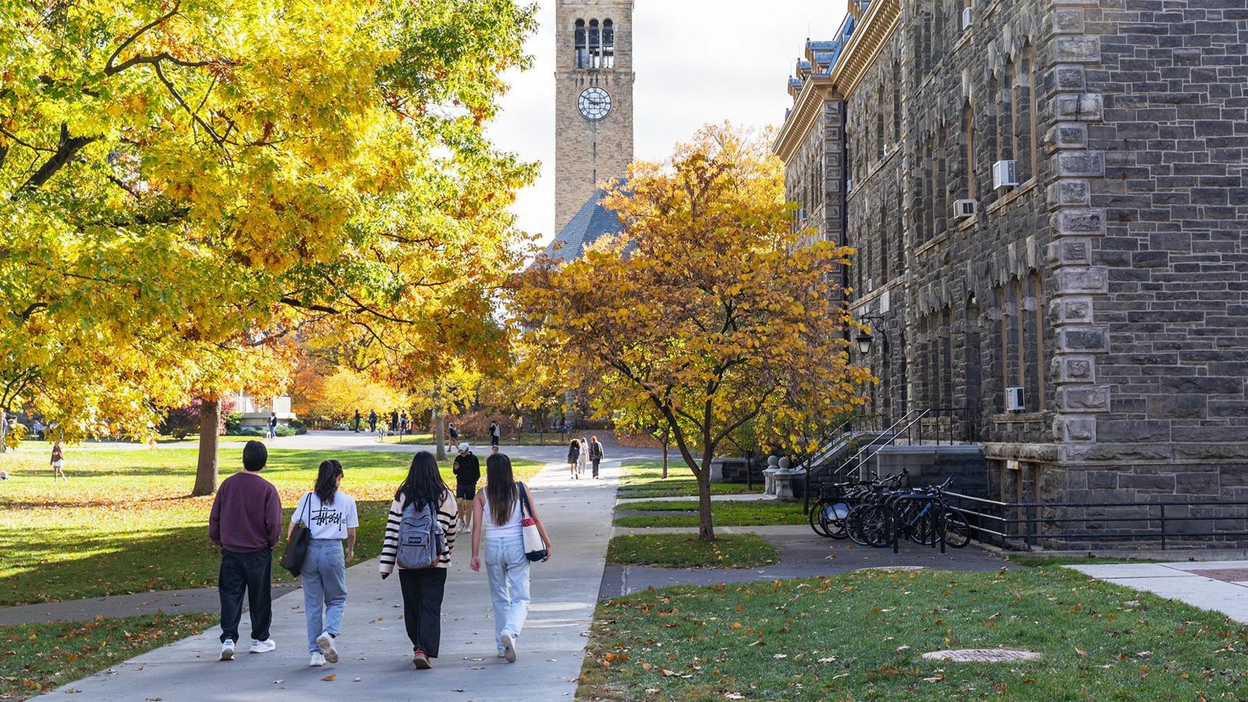 A stock picture of students walking in the Cornell university campus
