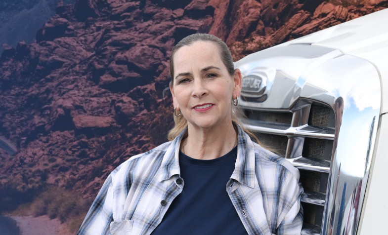 Bernadette Greene-Placentia poses for a portrait in front of a truck