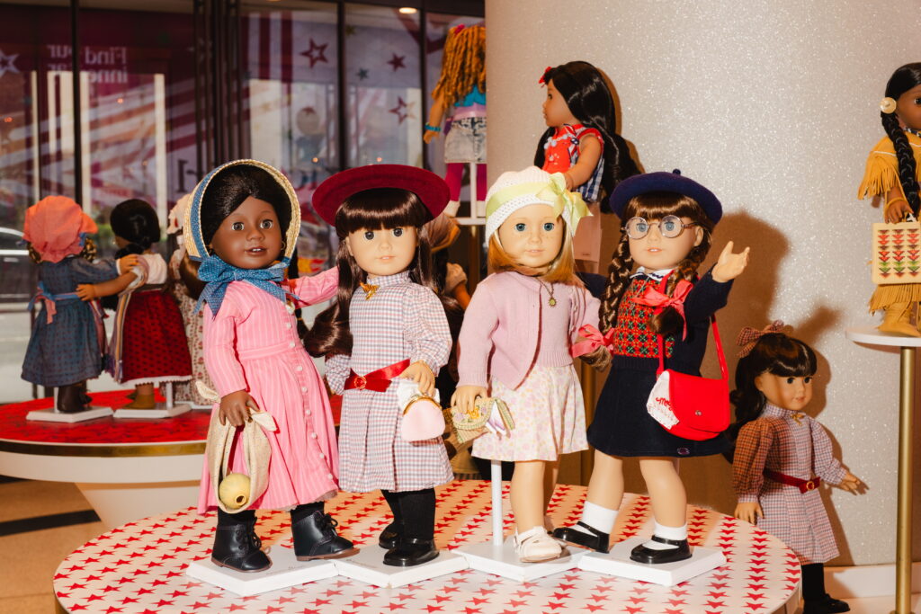 American Girl dolls of all eras are on display at the American Girl store in New York City.