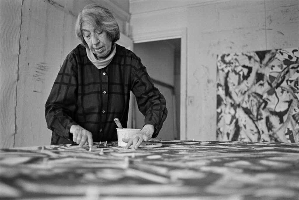 When Lee Krasner was asked in a 1978 interview what she was doing while her husband Jackson Pollock was becoming so famous, she said, "I was working all the time." Krasner is shown above, at work, in 1981.