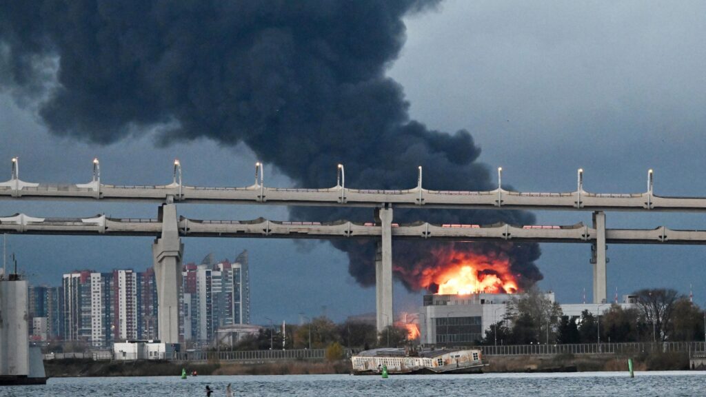 Flames emerge and smoke rises from St Petersburg's oil terminal following an aerial attack there on 18 October, 2026