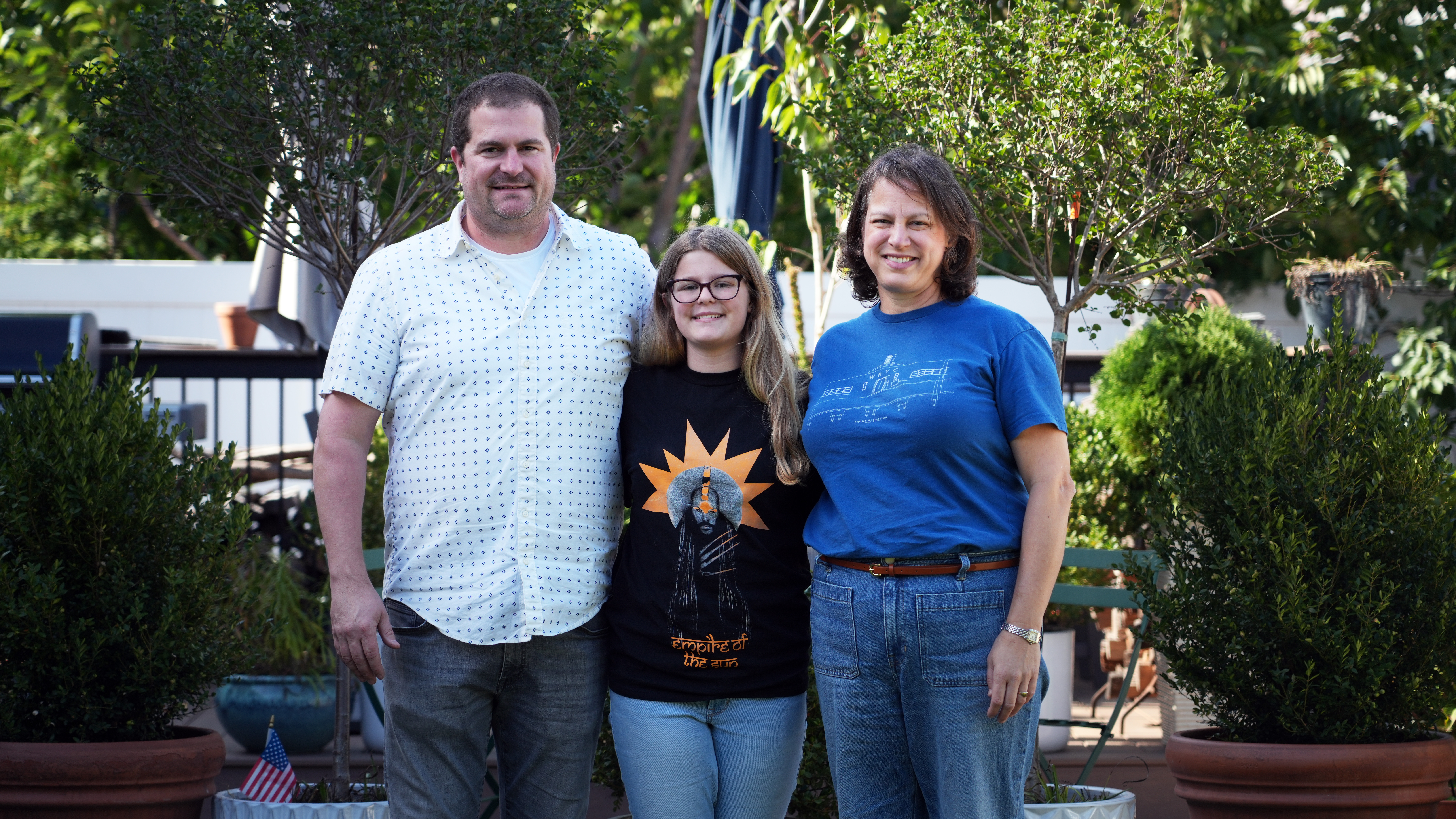 Cora Walsh with her parents, Chris Walsh and Emily Johnson.