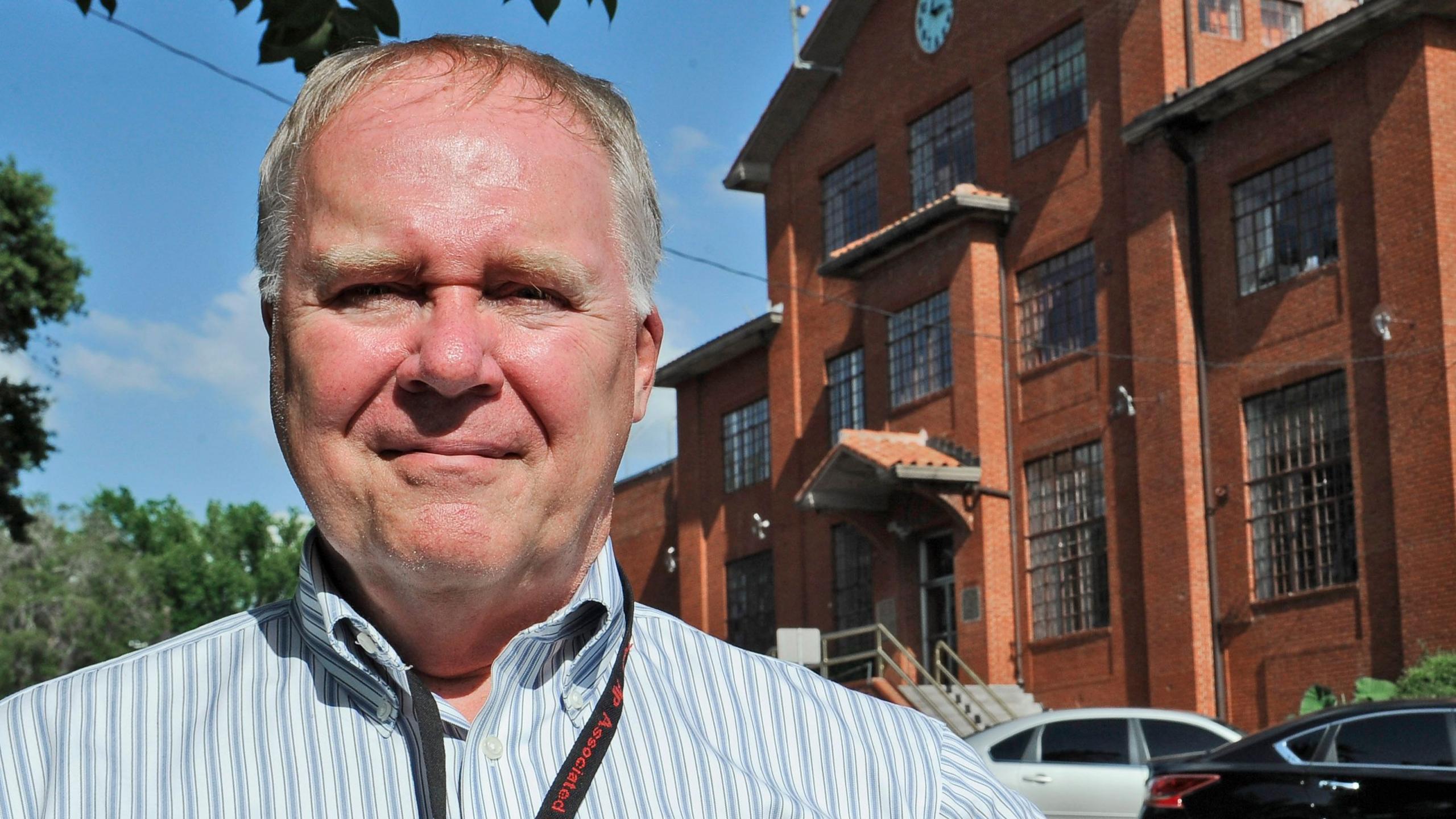Associated Press reporter Michael Graczyk stands outside the Huntsville Unit before witnessing the execution of confessed killer Elroy Chester in Huntsville, Texas. Chester was convicted of the 1988 the fatal shooting of Port Arthur firefighter Willie Ryman III.