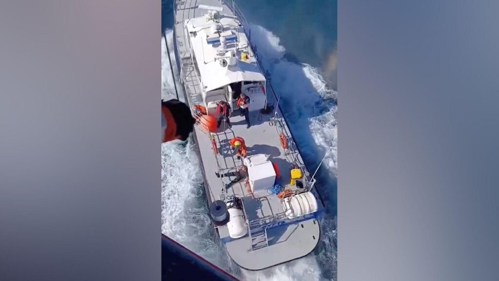 A rescue operation following a fire on a vessel outside Romania's territorial waters, in which two people died and others were rescued, in this screengrab obtained from a handout video released on October 5, 2026.