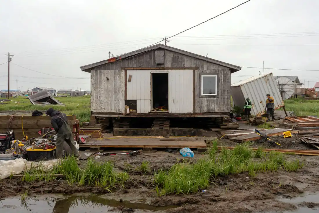 Construction crews work on houses and other building throughout Kipnuk after ex-typhoon Halong hit Alaska's coast in October of 2025.
